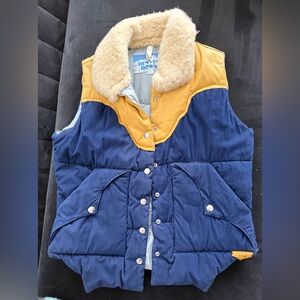 Denver Down Blue and Yellow Corduroy Puffy Vest with Faux Fur Collar.